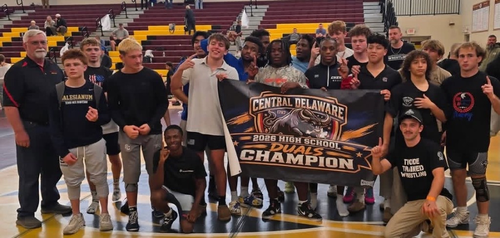 Thode Trained with the Central Delaware Duals championship banner